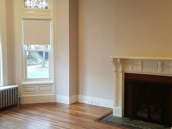 LR with original hard wood floors and woodwork