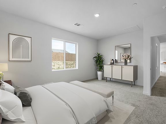 The master bedroom has enough space for a large bed and sidetables.