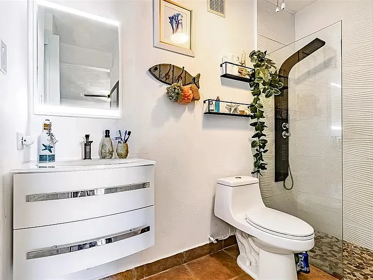 Second full bathroom attached to second bedroom and with access to living room
