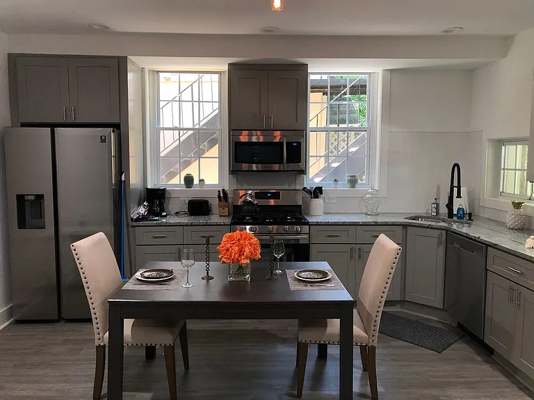 Open concept kitchen with new stainless steel appliances