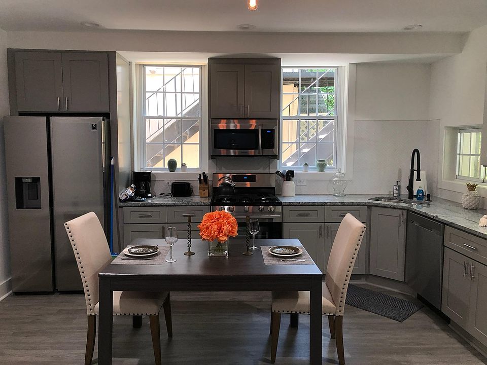 Open concept kitchen with new stainless steel appliances