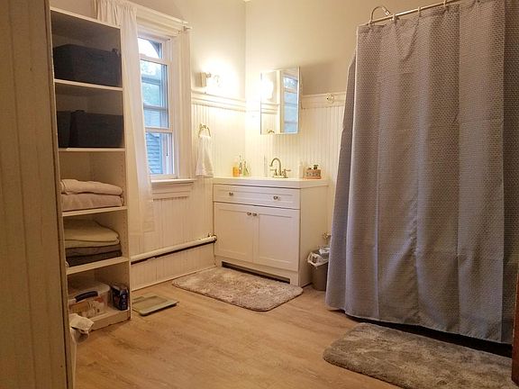 Huge bathroom with new flooring and vanity