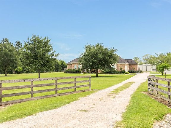 Gated home set back off road.
