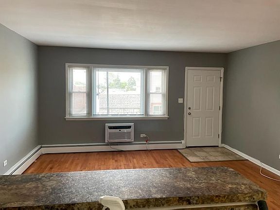 Living room wit 9000 BTU Air-conditioner. Pass through eating area