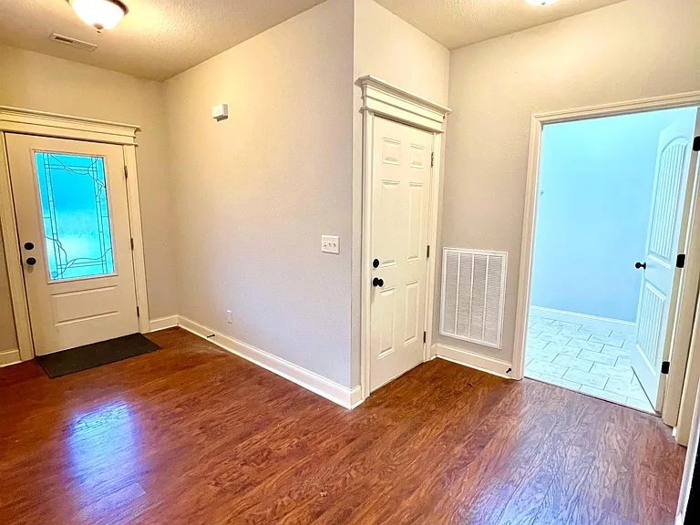 Front door, garage entrance, and laundry room.