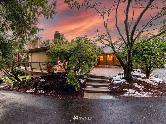 Seamless transition between entry, courtyard, and deck overlooking front yard.