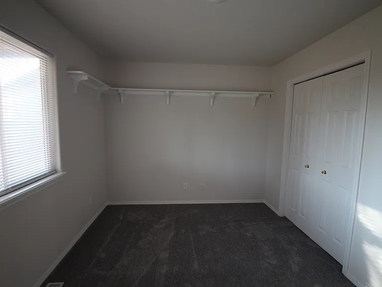 Rear bedroom with wrap around upper shelf