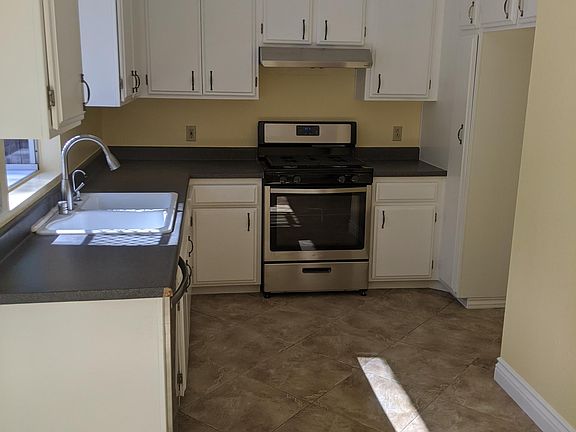 Kitchen with newly finished cabinets, brand new stove and dishwasher