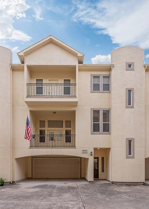 3-story townhome w/ 2 balconies in gated community.