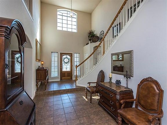Front entryway... slate tile flooring and very high ceilings! Formal dining room is directly on the right after you step down from the entryway.