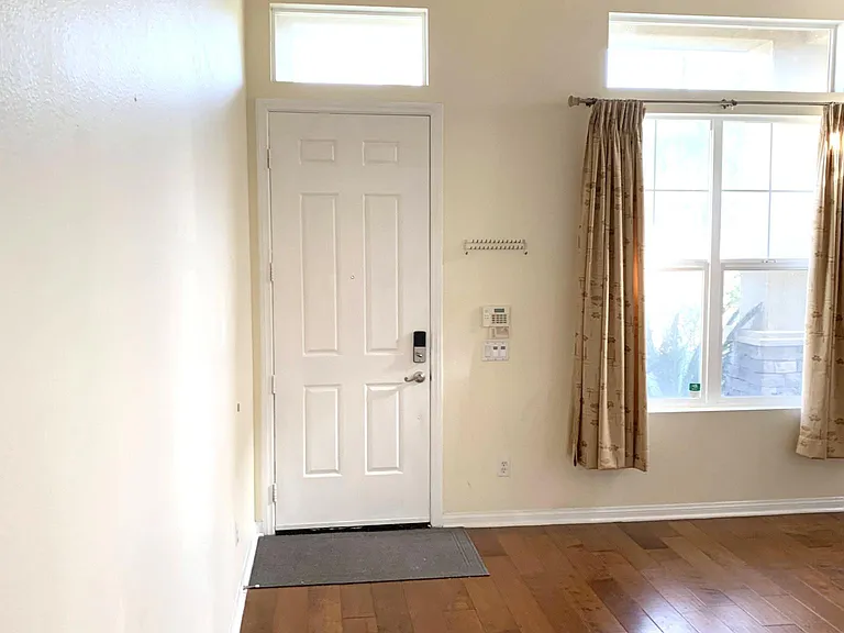Living Room. That door is how you enter the house