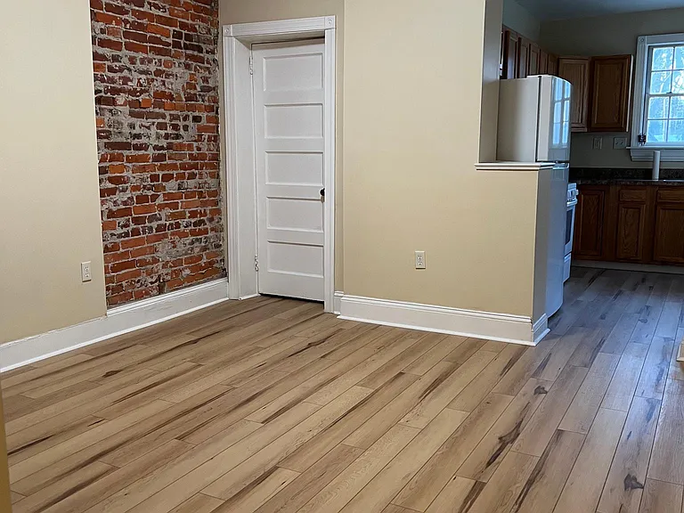 Dining room view towards bathroom on the left and kitchen on the right from Center Hall