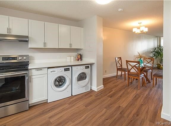 Full size BOSCH washer and dryer. Fridge and Stove/hood are brand new. Counters are white cultured marble. lots of cabinets and counter space.