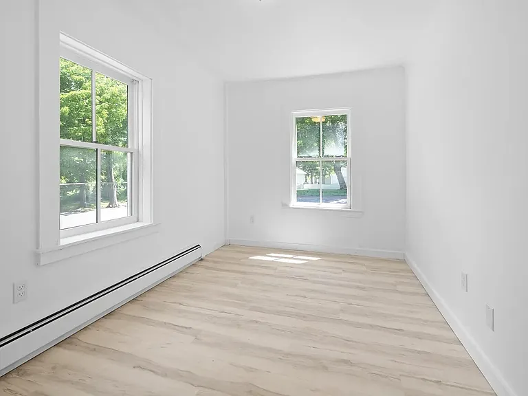 Bedroom One - First Floor. Space for a queen bed or two twins with headboard to the right in this photo.