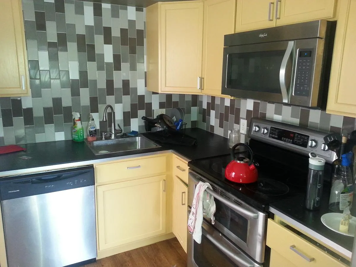 kitchen w pizza oven and kitchenaid dishwasher - 1931 W 47th Ave