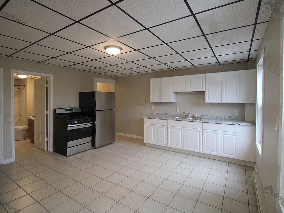 Kitchen with new stainless steel appliances, new counters, freshly painted walls