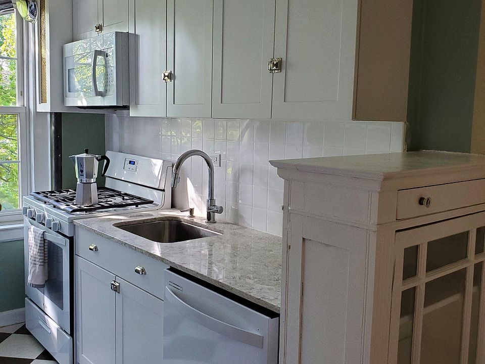 Kitchen recently updated with new dishwasher, cabinets, tile backsplash, countertop and extra deep undermount sink.
