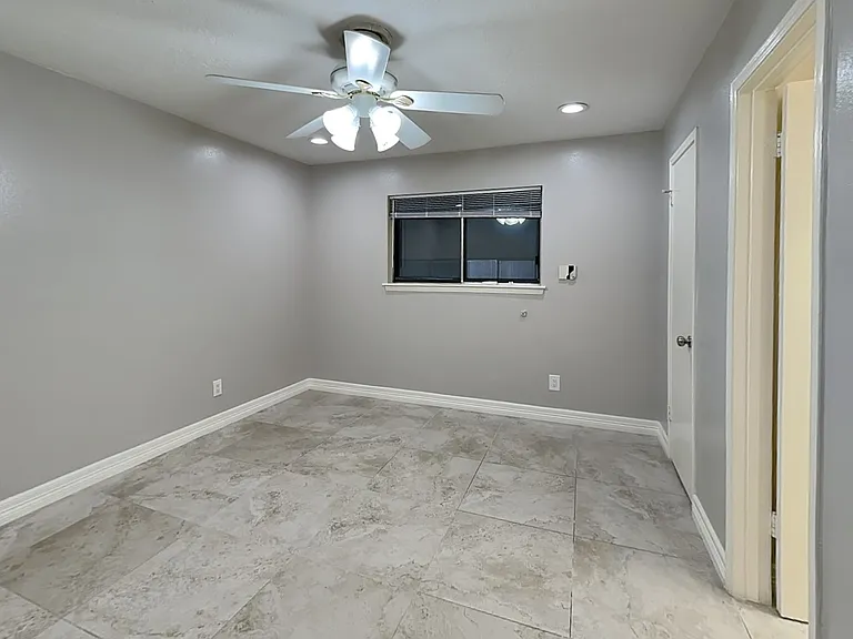 Spacious bedroom with neutral