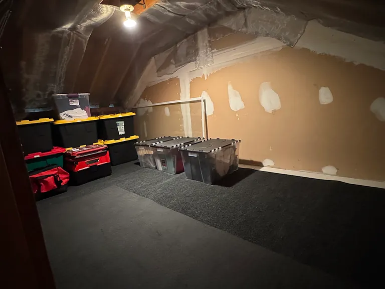 Attic Storage accessible from square door in Master Bedroom