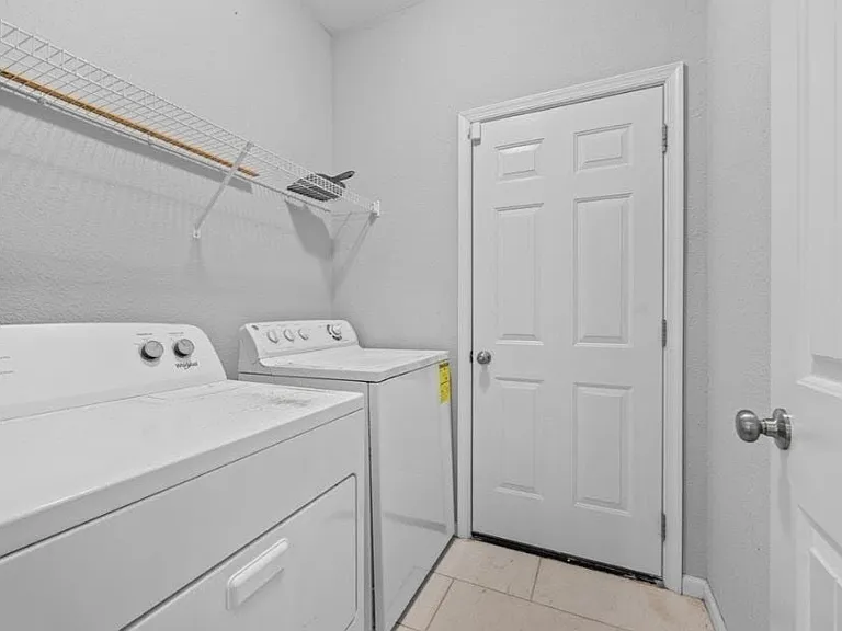 Transitional Laundry Room that leads to the Garage
