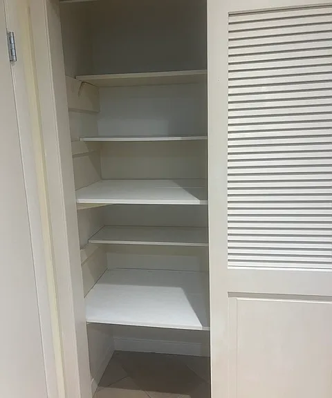 Bed room 1. Sliding doors with selves inside.