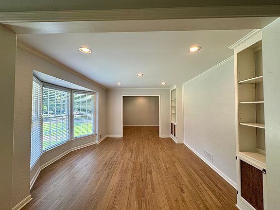 The bright formal living room and separate dining room are perfect for entertaining. They are larger than they appear here.