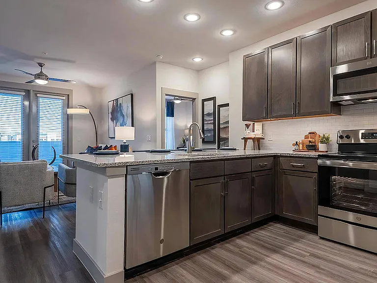 Stylish Kitchen with Dark Wood Cabinets and White Subway Tile Backsplash