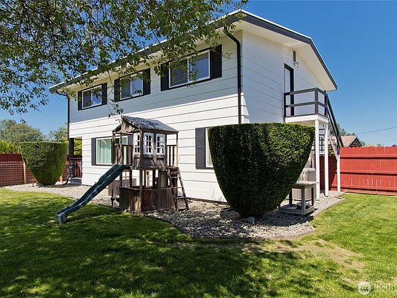 Back of home offers plenty of shade for the play area.>