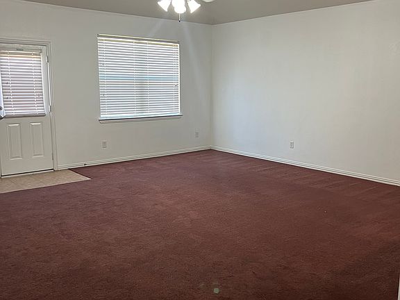 Large living room with access to back yard