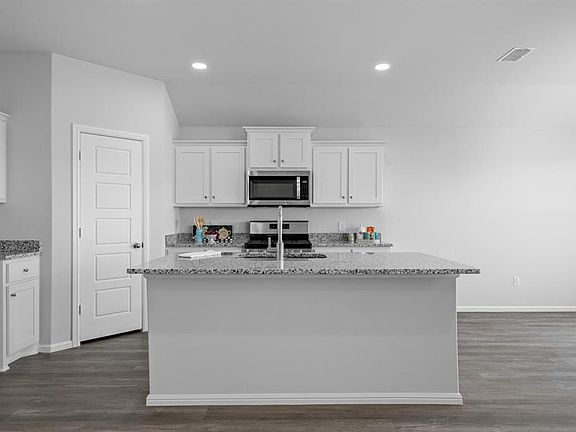 Kitchen - All Home and community information, including pricing, included features, terms, availability and amenities, are subject to change at any time without notice or obligation. All Drawings, pictures, photographs, video, square footages, floor plans, elevations, features, colors and sizes are approximate for illustration purposes only and will vary from the homes as built.