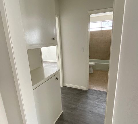 Hallway from Living room, Linen Cabinets
