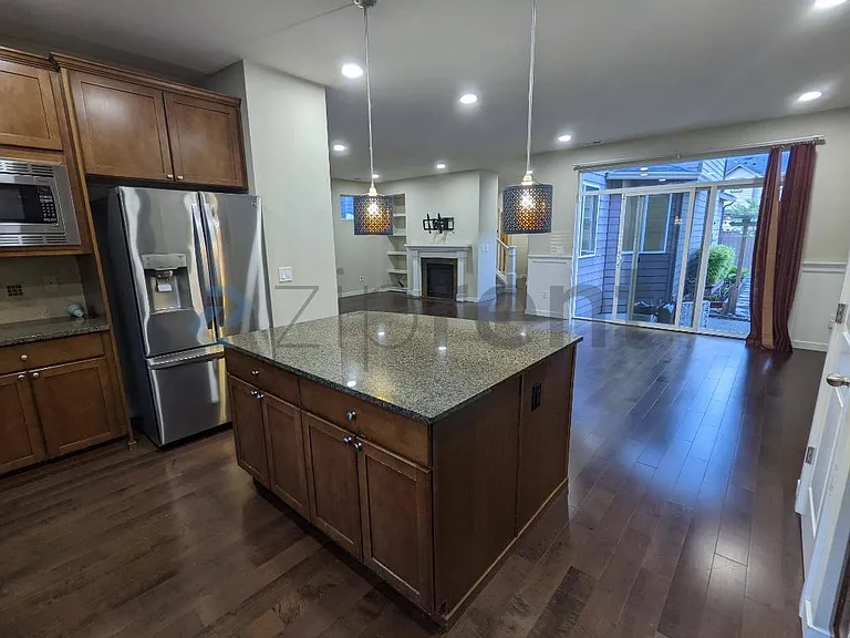 View from Kitchen into Dining area and Patio