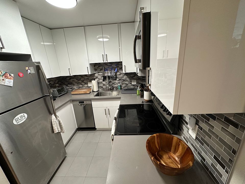 Modern kitchen with stainless steel appliances and dishwasher