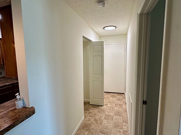 Entry to unit- coat closet on left with the doors open