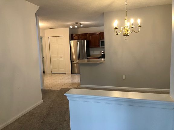 Dining Area or den/office area. (Chandelier being replaced with chrome track lights that match kitchen track light.)