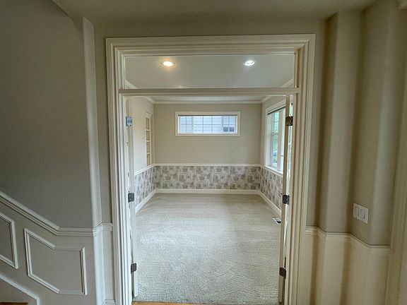 Office Den with large windows overlooking the yard and built-in bookcase.