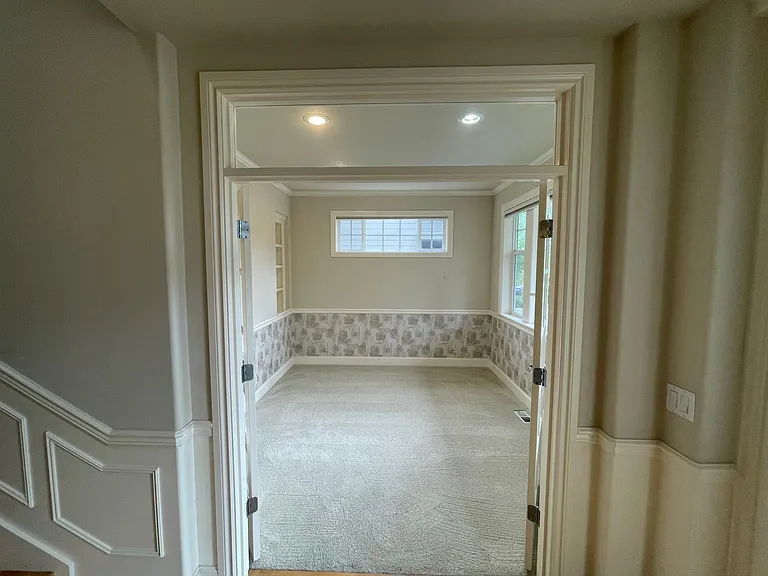 Office Den with large windows overlooking the yard and built-in bookcase.