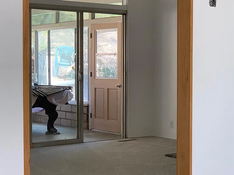 View from entertaining room into living room and Sun room