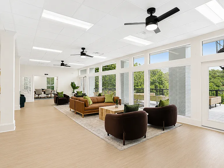 Enjoy a bright clubhouse space with comfortable seating and scenic views.
