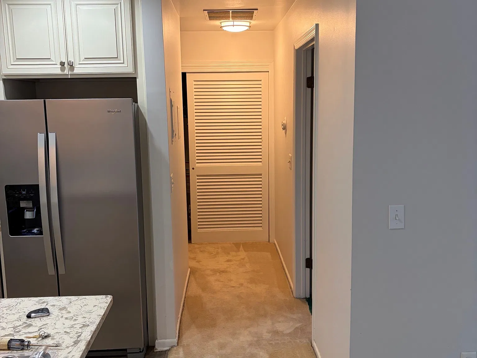 Hallway, bedroom door on right
