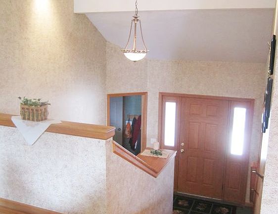 Impressive front Entry greets guests with cathedral ceiling views and ceramic tile flooring. A large