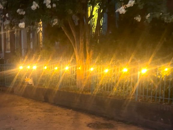 Cafe lights all the way around the fencing