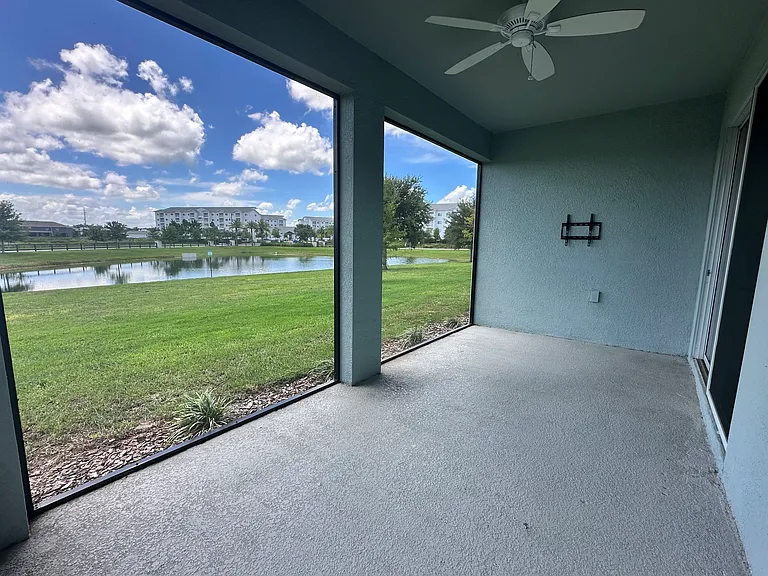 Private screened-in Lanai with views of pond.