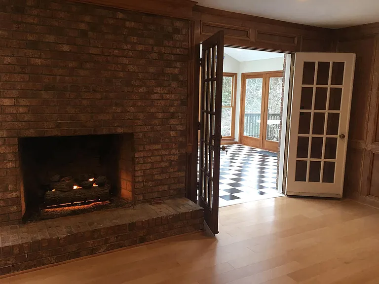 Living room adjacent to sunroom