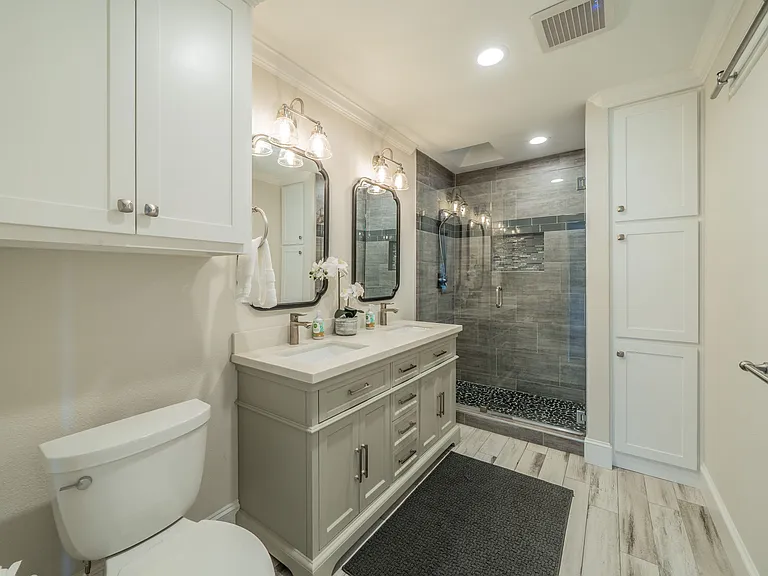 Sleek Guest Bath: Double Vanity, Glass Walk-In Shower & Ample Storage