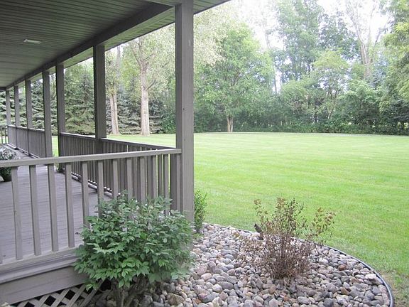 Amazing front porch with views of the expansive front yard.