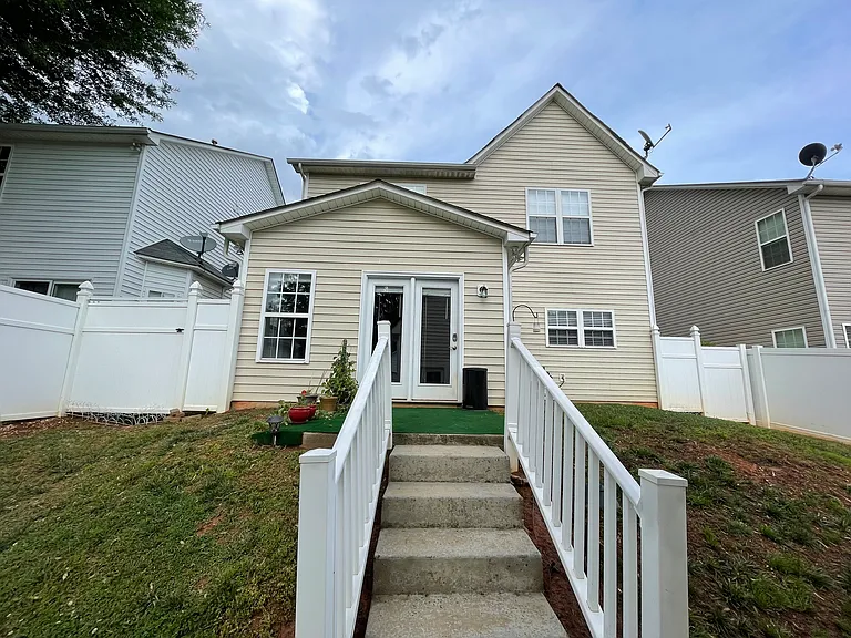Back view with fenced yard