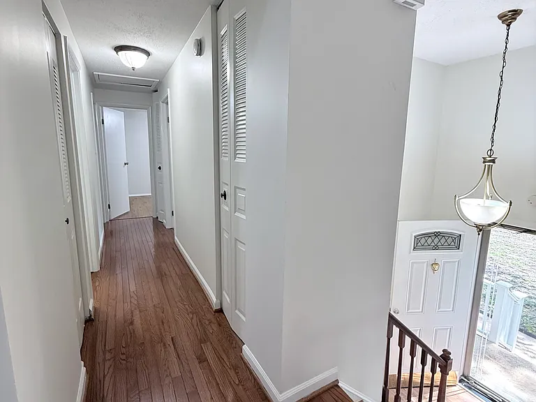 hallway with 3 bedrooms and 2 full baths