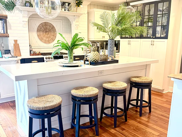 Open Kitchen with expansive quartz counter top island which can seat up to five