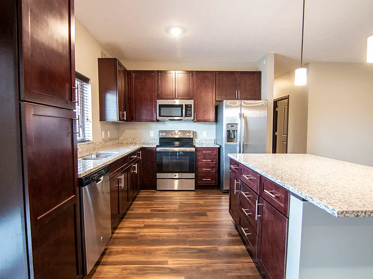 You'll love spending time in these kitchens, complete with extra storage, granite countertops and sophisticated pendant lighting.
